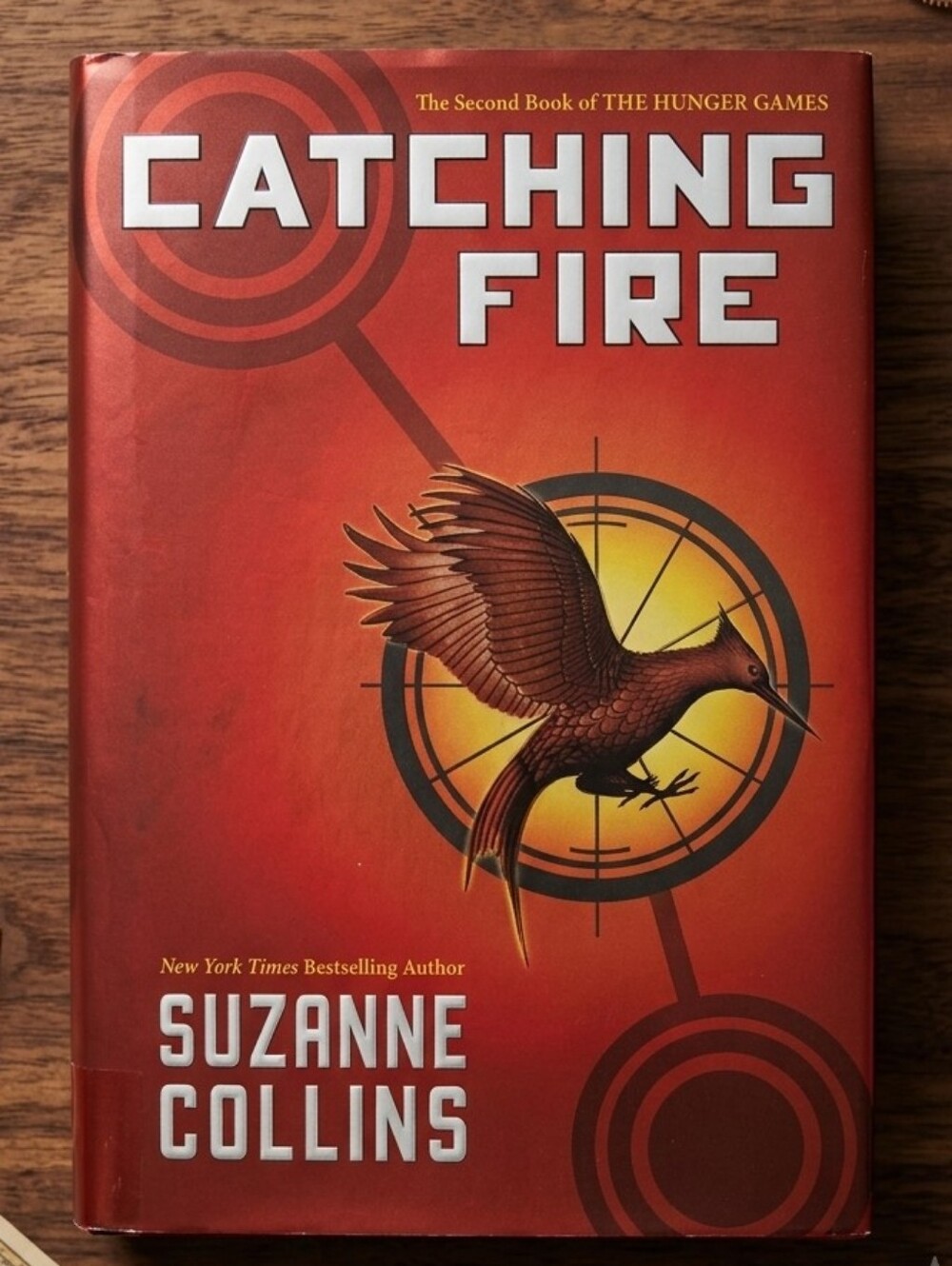 Catching Fire by Suzanne Collins - Red Hardcover